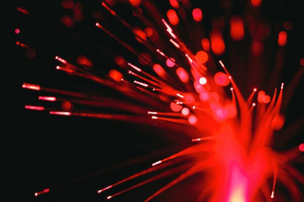 A close up of a red and black firework